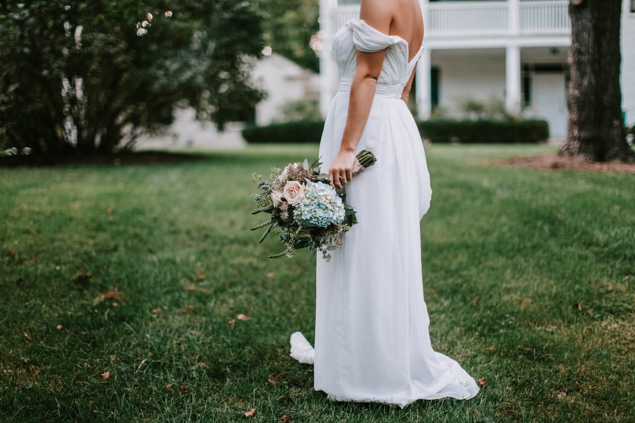 If you decide to host a wedding at home, you can make an intimate, charming, and unique celebration with your loved ones.Photo by Leah Kelley via Pexels